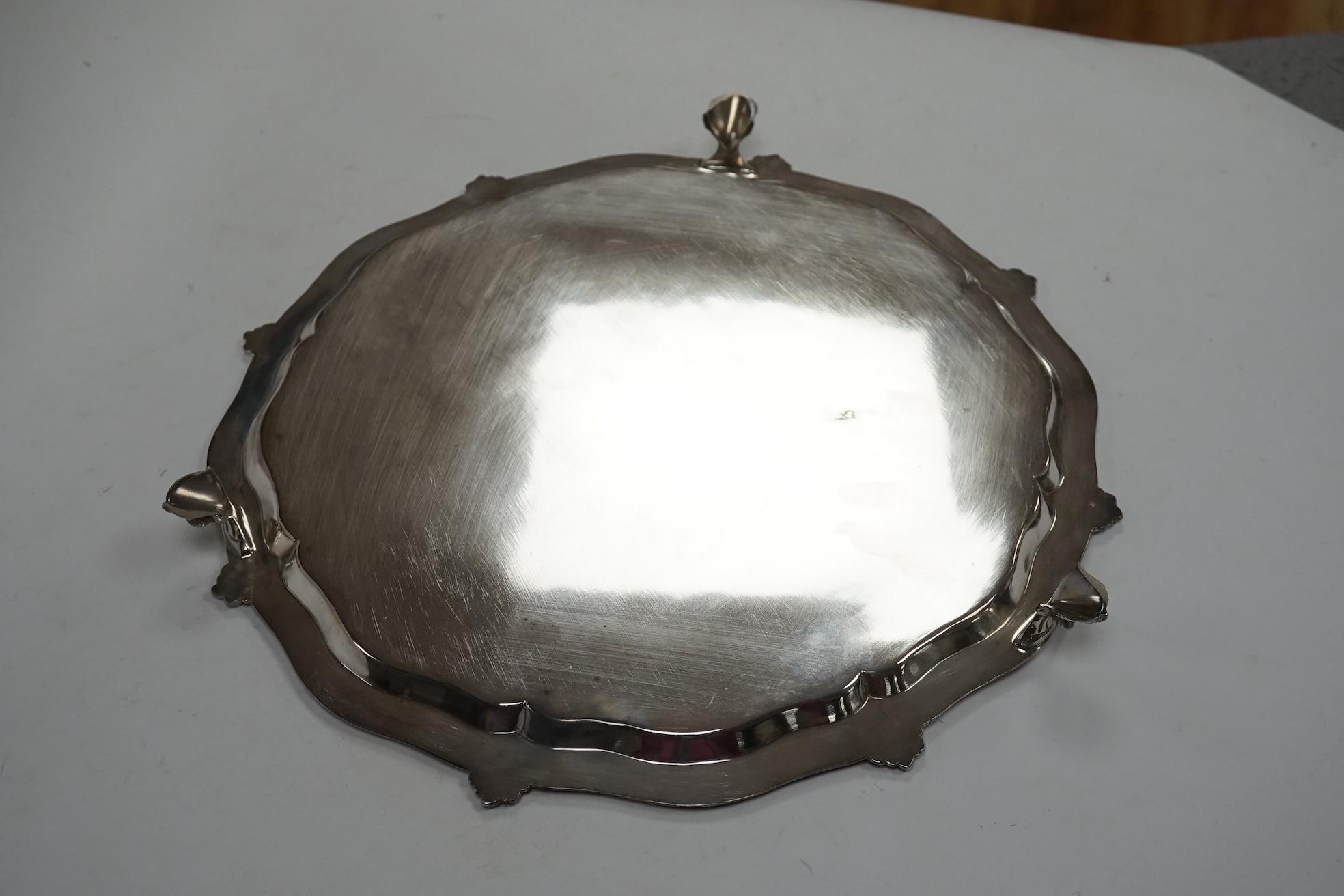 An Edwardian silver salver, with later engraved inscription, on three claw feet, Henry Wigful, Sheffield, 1907, 32.3cm, 27.9oz. Condition - fair to good